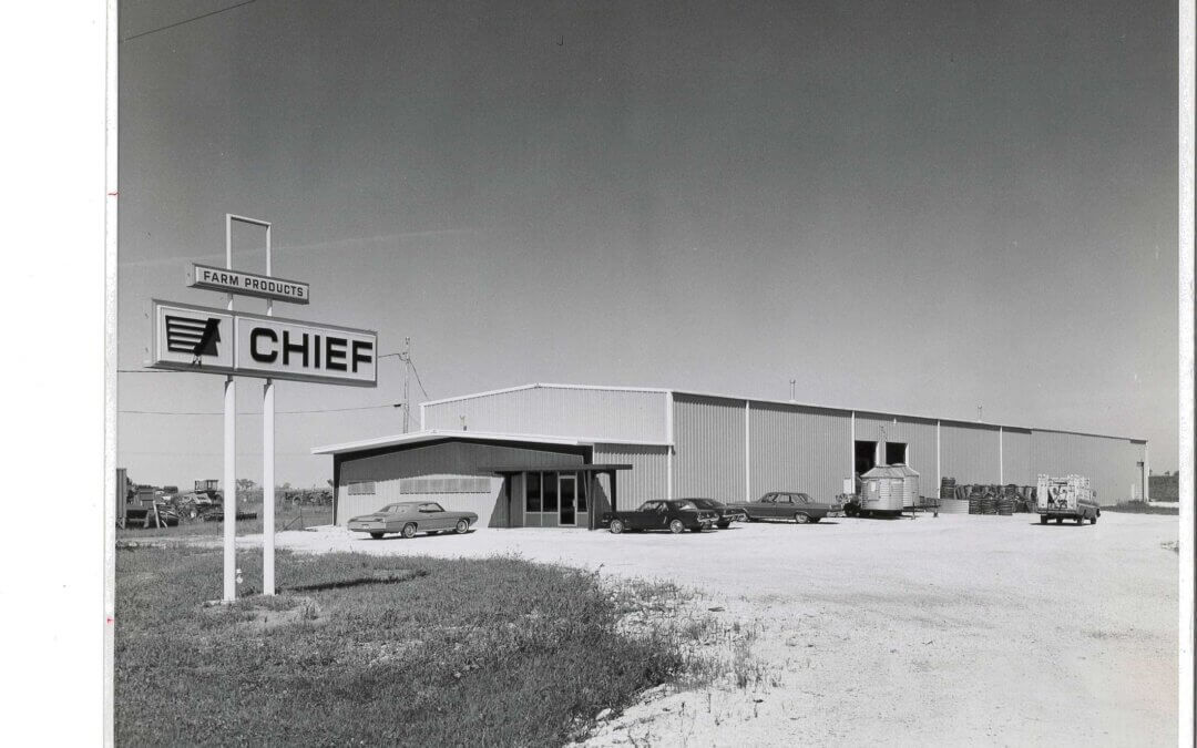 Black and white photo of the Chief Industries building with a large “Chief Farm Products” sign, marking the company's transition from Big Chief of Nebraska, Inc.